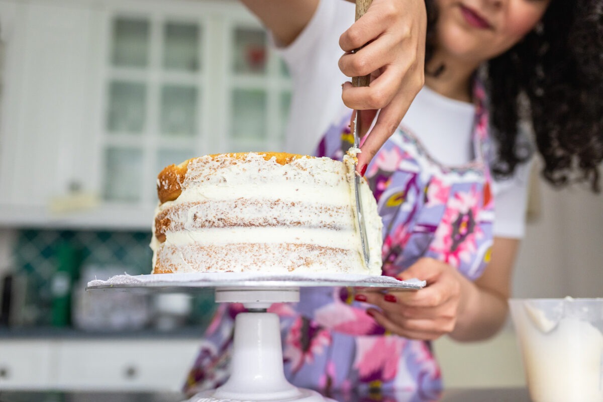 Rana's Delights decorating cake, baker based in Teddington and Richmond - Personal branding photoshoot in London